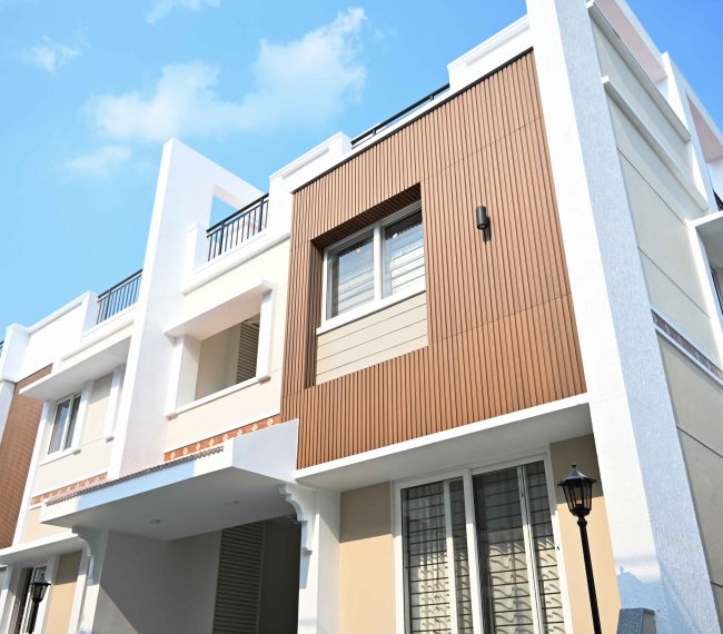 Modern building facade with WPC exterior cladding and fluted wall panels.